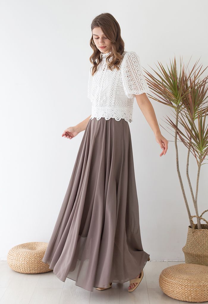 maxi skirt with a tucked in blouse